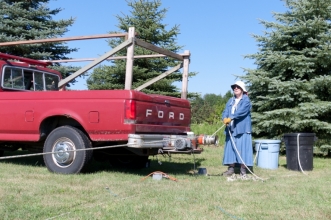 Mary Bittner running the Capstone winch to raise and lower hams and tools